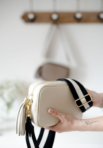 Cream Leather Tassel Cross Body Bag with monochrome stripe strap