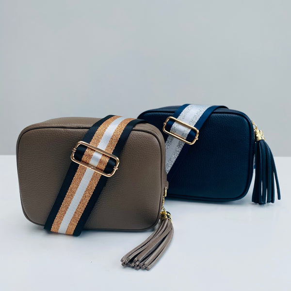 navy blue and silver stripe bag strap on navy leather tassel bag