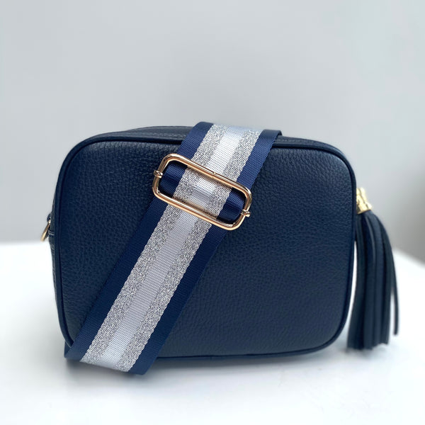 navy blue and silver stripe bag strap on navy leather tassel bag
