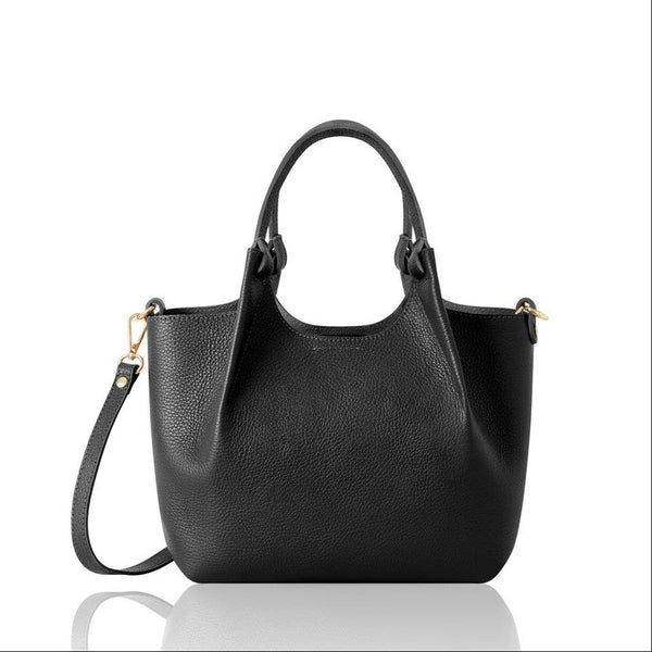 Black handbag with a crossbody strap and top handles on a white background