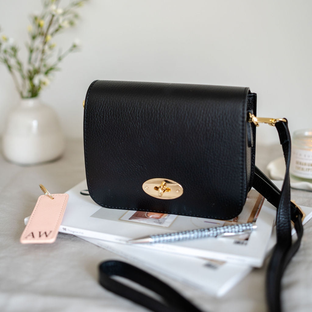 Black Leather Crossbody Lock Bag photog
raphed by AnySomething Photography
