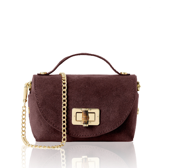 burgundy handbag with gold chain and clasp on a white background