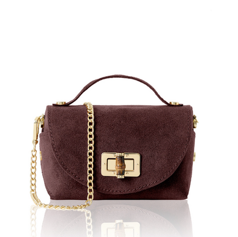 burgundy handbag with gold chain and clasp on a white background