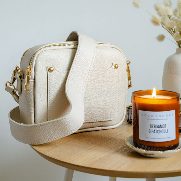 Cream leather double zip bag with Coco Sunday candle.  Photographed by AnySomething Photography.