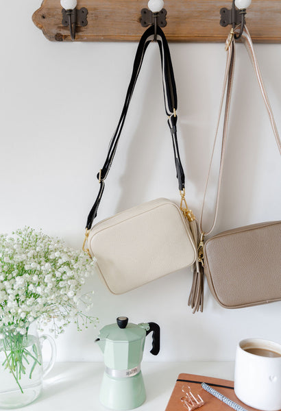 Cream Leather Tassel Cross Body Bag with monochrome stripe strap