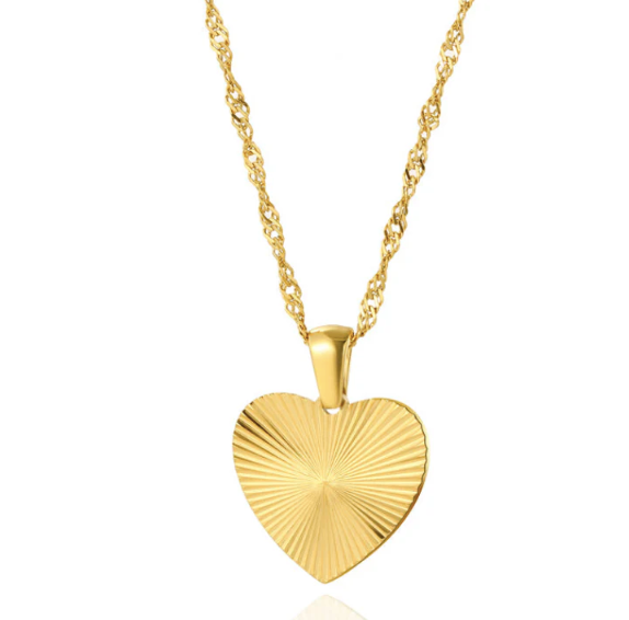 Gold heart-shaped pendant on a chain against a white background