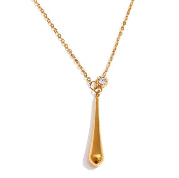 Gold teardrop necklace with a crystal detail on a fine chain with a white background