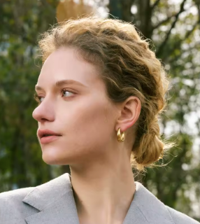 Gold oval hoop earrings Misgraceful on model