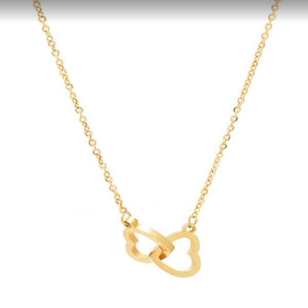 two hearts linked together in a gold necklace on a white background