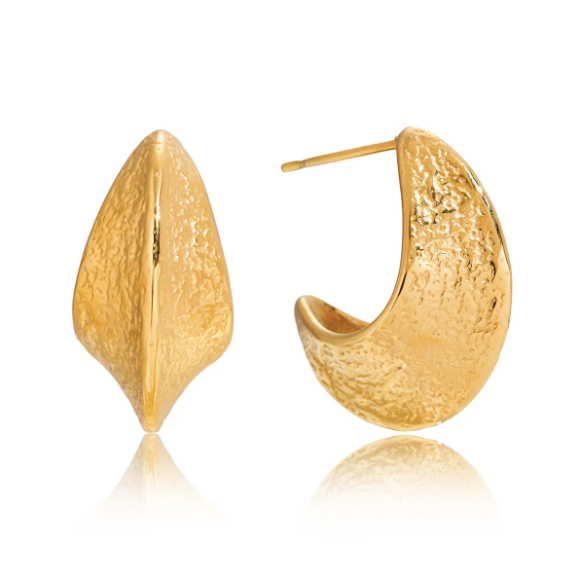 A pair of textured gold huggie hoop earrings, one shown from the front and the other from the side/back, on a white background with a soft reflection.