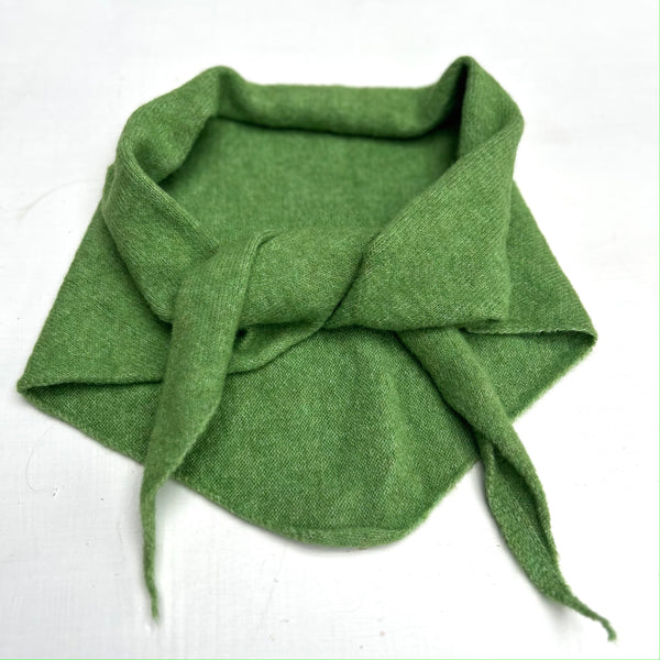 Green wool scarf on a white background
