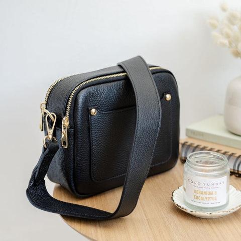 Black leather double zip bag with Coco Sunday candle.  Photographed by AnySomething Photography.