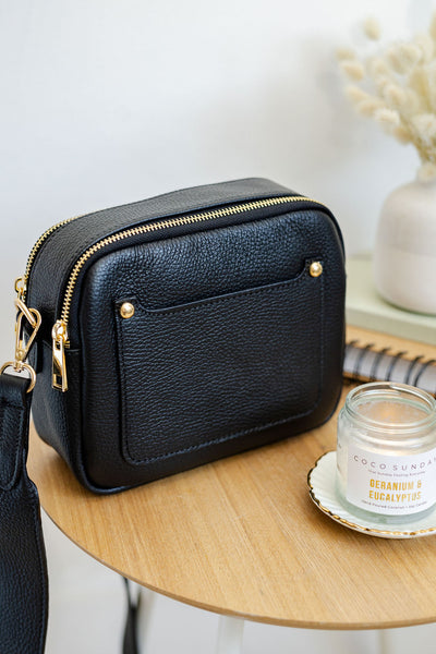 black leather double zip bag with Codo Sunday candle.  Photographed by AnySomething Photography.