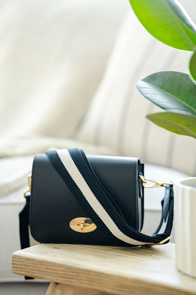 Black Leather Crossbody Lock Bag with monochrome strap