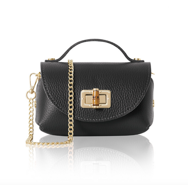 Black mini handbag with gold chain and bamboo style clasp on a white background