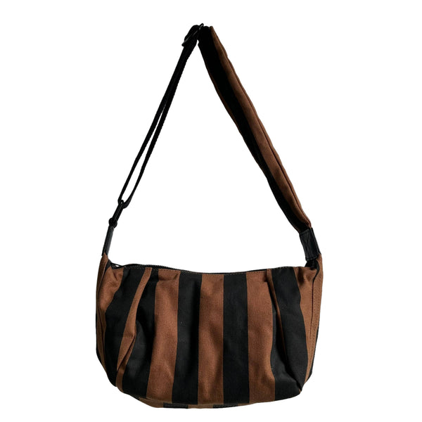 A brown and black vertically striped shoulder bag with a wide shoulder strap, shown against a plain white background.
