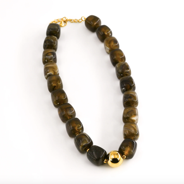 Necklace with brown beads and gold accents on a white background