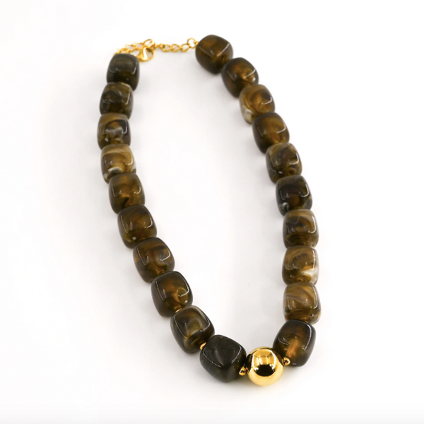 Necklace with brown beads and gold accents on a white background