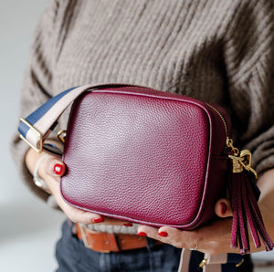 Burgundy Leather Tassel Cross Body Bag with navy blush bag strap. AnySomething Photography