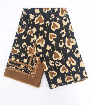 A scarf with a mixed camel and stone leopard print with gold highlights on a black background, with a striped edge.