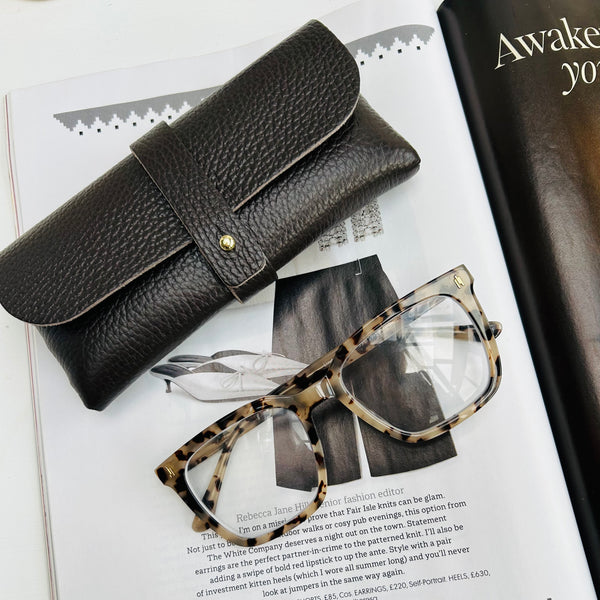 Chocolate Brown leather glasses case on a magazine with tortoiseshell glasses