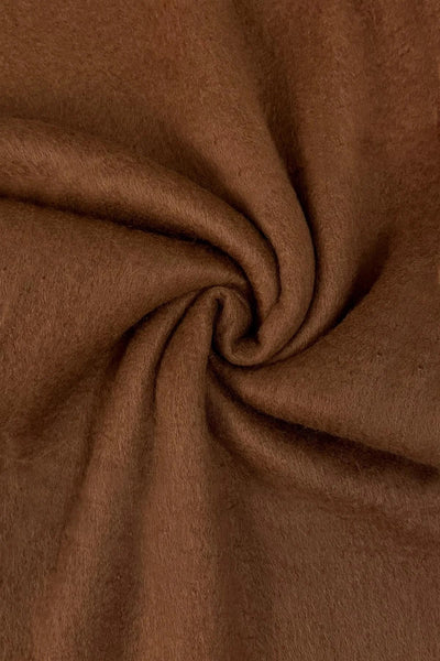 Close-up of brown fabric with a swirl pattern