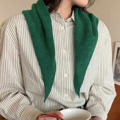 Forest Green skinny triagle knit scarf worn open over a striped shirt by a women holding a cup of coffee