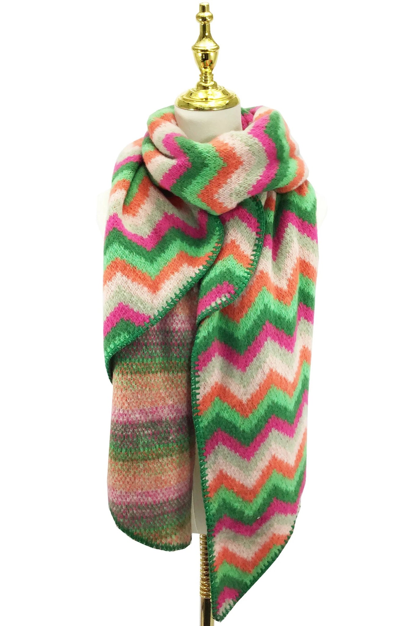 Colorful zigzag patterned scarf on a mannequin with a white background