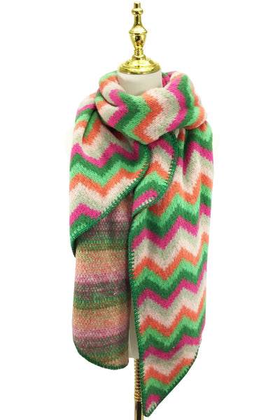 Colorful zigzag patterned scarf on a mannequin with a white background
