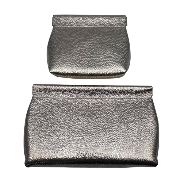 Large and small metallic leather gold pouches on a white background