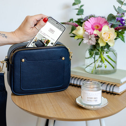 navy blue leather double zip bag with Coco Sunday candle.  Photographed by AnySomething Photography.