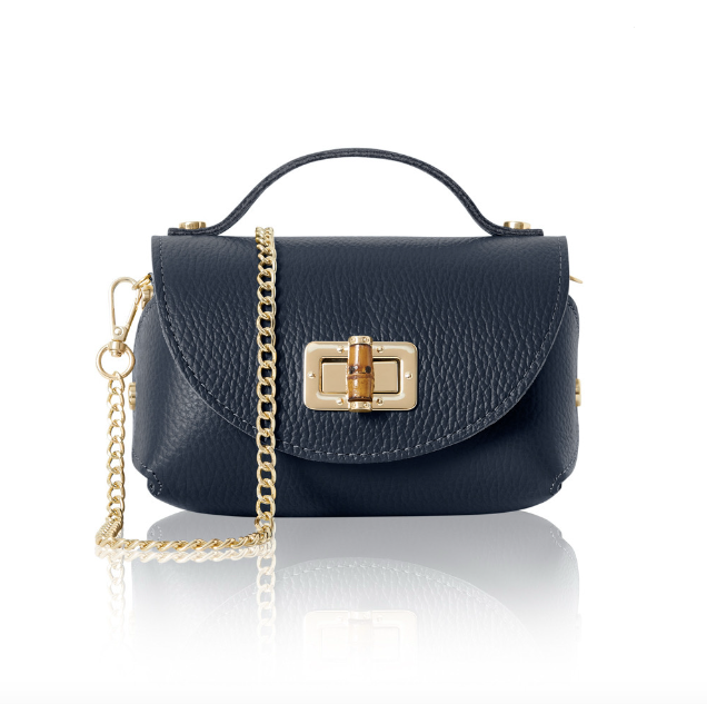 Navy blue mini handbag with gold chain and bamboo style clasp on a white background