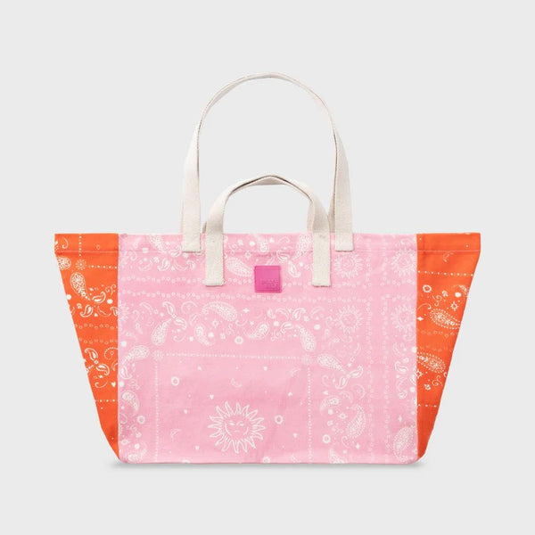 Tote bag with pink and orange bandana paisley pattern on a white background