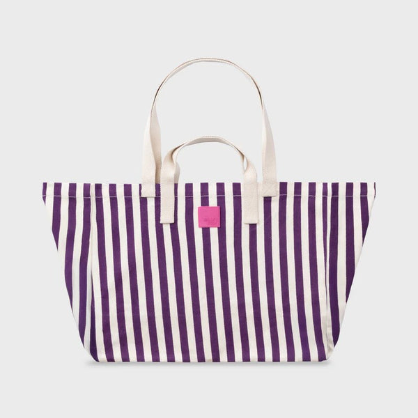 Striped tote bag with purple and white stripes on a light gray background