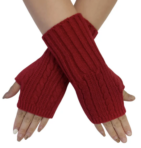 Red knitted arm warmers on a white background
