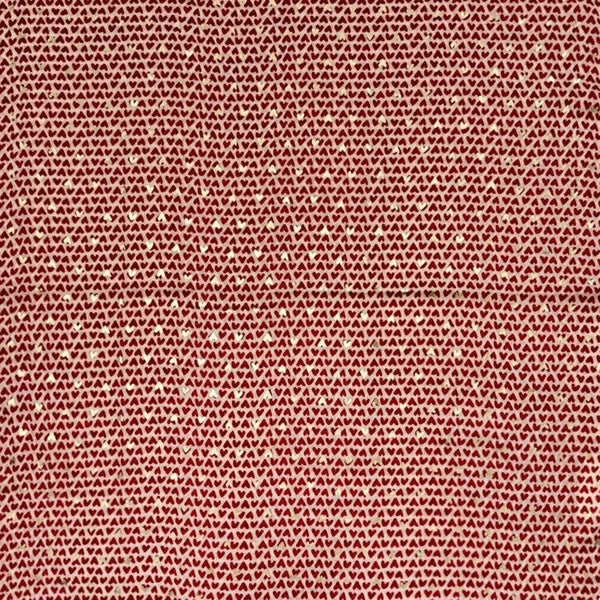 Textured pink and white heart patterned fabric on a white background