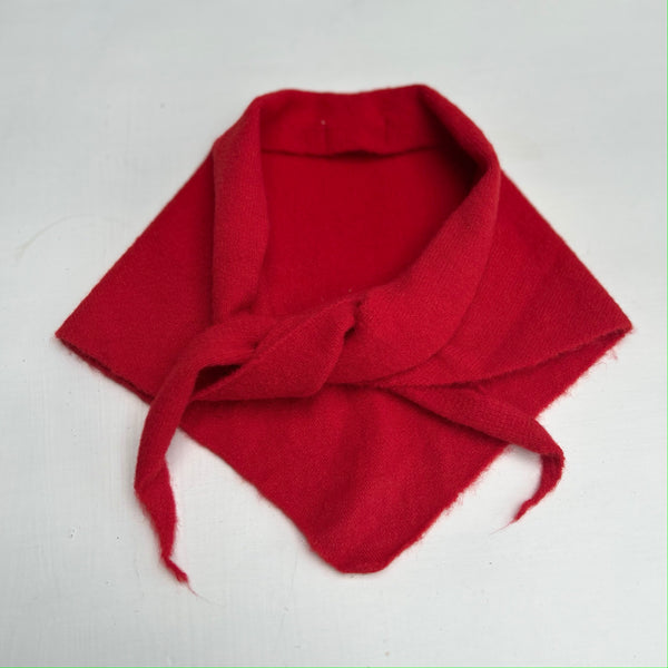Red knitted scarf on a white background