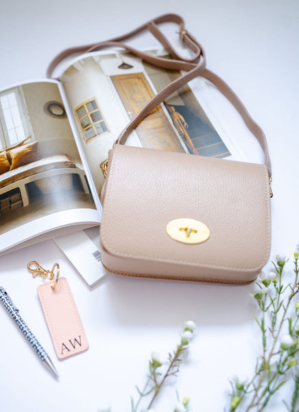 Rose Pink Leather Lock Crossbody Bag with slim strap. By AnySomething Photography