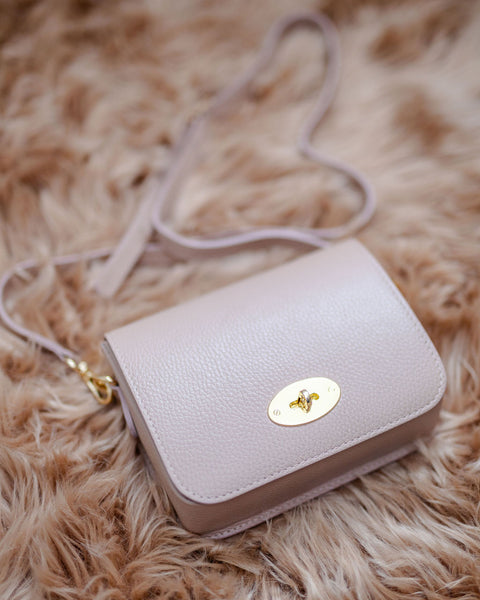 Rose Pink Leather Lock Crossbody Bag with slim strap. By AnySomething Photography