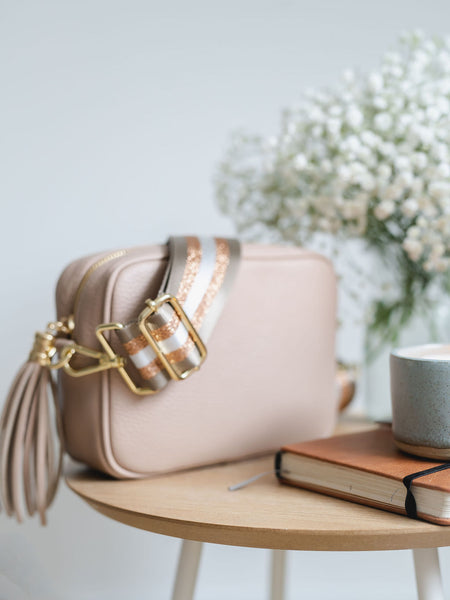 Rose Pink Leather Tassel Cross Body Bag with rose gold and taupe stripe bag strap