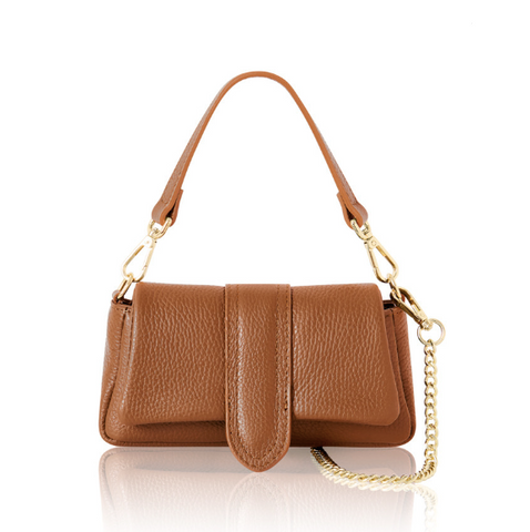 tan leather handbag with gold chain strap on a white background