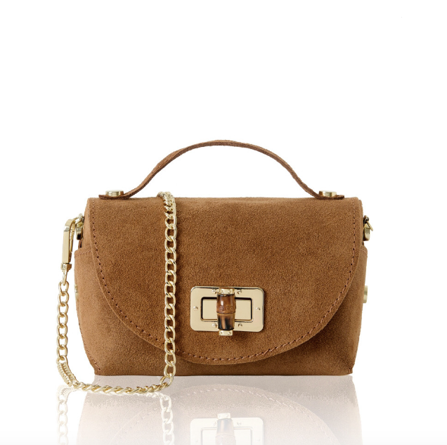Brown suede handbag with a gold chain and bamboo clasp on a white background