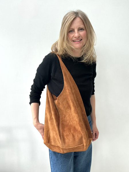 Tan suede slouchy tote worn by Cathy 