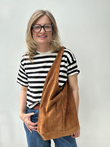Tan suede slouchy tote worn by Cathy 