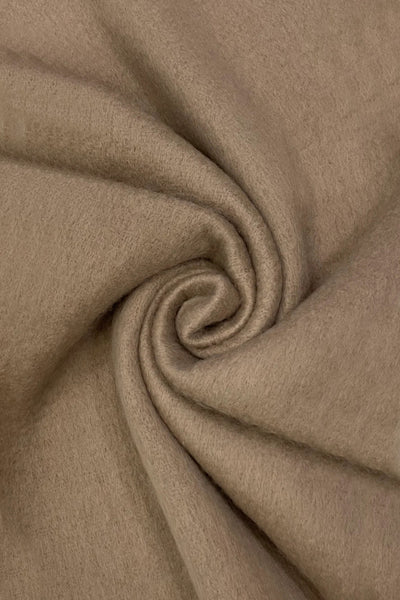 close up of soft taupe fabric in a swirl