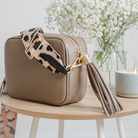 Taupe Leather Tassel Cross Body Bag with pink animal print bag strap