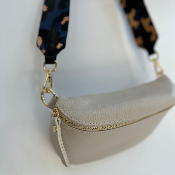 Large Cream Leather Waist Crossbody Bag with navy animal print bag strap