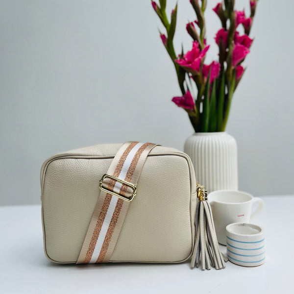 Cream Leather Large Tassel Cross Body Bag with pale taupe and rose gold stripe bag strap